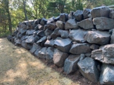 Retaining wall with boulders