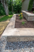 Tiered stone retaining wall with mulch